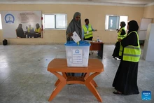 A Somali voter casts her vote at a polling station in Mogadishu, Somalia, Dec. 25, 2025. More than 500,000 voters in Somalia's capital, Mogadishu, cast ballots on Thursday in municipal elections widely seen as a key step toward the country's first direct national elections in more than five decades, scheduled for 2026. (Photo: Xinhua)
