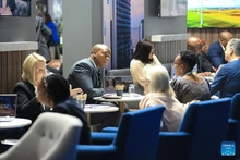 People communicate at the Meetings Africa 2026 in Johannesburg, South Africa, Feb. 24, 2026. The Meetings Africa 2026 opened at the Sandton Convention Centre in Johannesburg on Tuesday. (Photo: Xinhua)