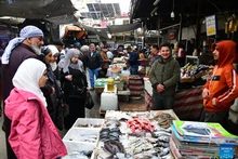 Syrians buy frozen fish at a fish market in Damascus, Syria, Feb. 23, 2026. Popular markets in Damascus have become crowded during the holy month of Ramadan, with shoppers searching for cheaper options amid economic hardship. (Photo: Xinhua)