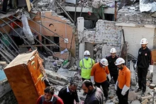 Security personnel examine the site of a gas explosion in Islamabad, capital of Pakistan, on Jan. 11, 2026. The death toll from a gas explosion at a wedding house in Pakistan's federal capital, Islamabad, has risen to eight, including a newlywed couple, while 11 others were injured, local authorities said on Sunday. Authorities said the exact cause of the explosion will be determined following a detailed investigation. (Str/Xinhua)