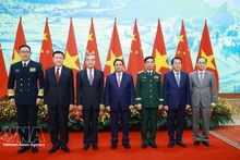 Prime Minister Pham Minh Chinh (centre) and the Vietnamese and Chinese ministers of foreign affairs, national defence and public security at the meeting in Ha Noi on March 16. (Photo: VNA)