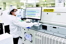 The electronic component production line at the 100% Korean-invested Bumjin Electronics Vina Co. Ltd in Quang Ninh. (Photo: Tran Hai)