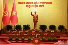 General Secretary To Lam presents a report on the documents submitted to the 14th National Congress of the Communist Party of Viet Nam at the opening session. (Photo: TRAN HAI)