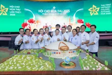 Artisans and the model of the National Exhibition and Convention Centre at the first Autumn Fair 2025.