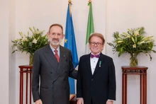 Greig Craft (right) and Marco della Seta, Ambassador of Italy to Viet Nam, at the medal presentation ceremony.