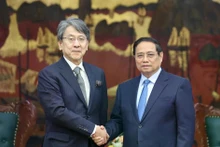 Prime Minister Pham Minh Chinh and Chairman of Japan Bank for International Cooperation Maeda Tadashi. (Photo: VNA)