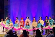 An ao dai fashion show at the grand music programme on March 8, presented by the Vietnamese ao dai heritage club in Belgium in coordination with the UGVB Women’s Association. (Photo: VNA)