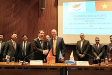 Vietnamese Deputy Minister of Finance Cao Anh Tuan and Cypriot Minister of Finance Makis Keravnos.