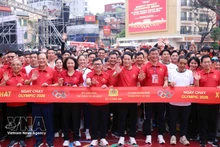 People join the 2026 Olympic Run Day for public health, national security in Ha Noi. (Photo: VNA)