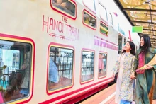 Tourists experience the ‘Ha Noi 5 Gates’ tourist train, a new tourism product in Ha Noi. (Photo: Bao Long)