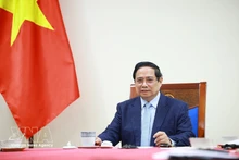 Prime Minister Pham Minh Chinh in the phone talks with Kuwaiti Prime Minister Sheikh Ahmed Abdullah Al-Ahmad Al-Sabah on March 9 (Photo: VNA)
