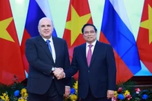 Prime Minister Pham Minh Chinh and Russian Prime Minister Mikhail Mishustin pose for a group photo on January 14, 2025. (Photo: VNA)