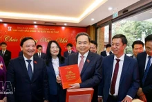 NA Chairman Tran Thanh Man (centre) at the book launch in Ha Noi on February 24. (Photo: VNA)