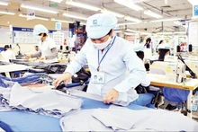 Workers at Garment Corporation 10 produce clothing for export. (Photo: Nguyen Dang)
