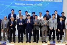 Delegates pose for a commemorative photo at the conference.