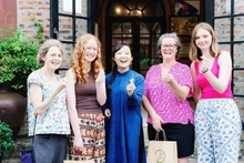 International visitors engaging with the cultural experiences at Sinh Duoc.