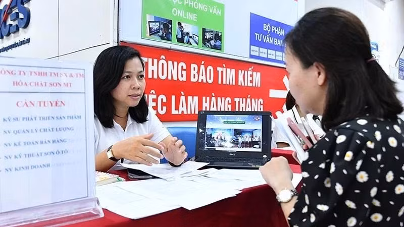 A labourer seeking employment information at the Ha Noi Employment Service Centre. 