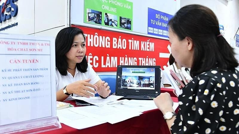A labourer seeking employment information at the Ha Noi Employment Service Centre. 