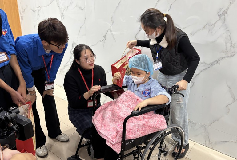 Gifts presented to a child patient ahead of Lunar New Year Festival (Tet)