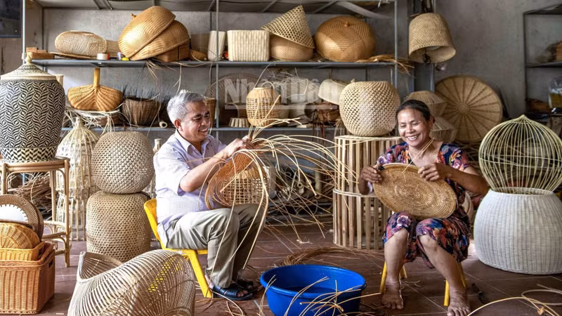 Artisans at work in a bamboo and rattan workshop in Phu Vinh Village, Phu Nghia Commune, Ha Noi.