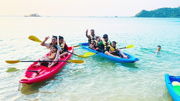 Tourists enjoying a kayaking trip on Thanh Lan Island