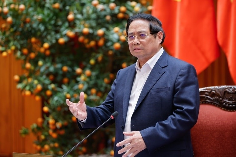 Prime Minister Pham Minh Chinh addresses the meeting meeting between the permanent Government members and leaders of Hanoi to review and provide feedback on the draft Ha Noi Capital Master Plan with a 100-year vision on March 14. (Photo: baochinhphu.vn)