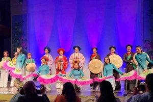 An ao dai fashion show at the grand music programme on March 8, presented by the Vietnamese ao dai heritage club in Belgium in coordination with the UGVB Women’s Association. (Photo: VNA)