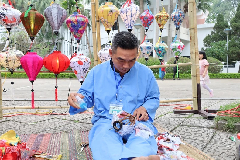 An artisan is making lanterns An artisan is making lanterns