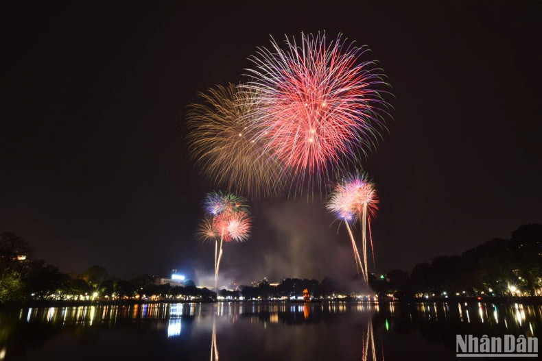 Fireworks bloom in the night sky of Hanoi. Fireworks bloom in the night sky of Hanoi.