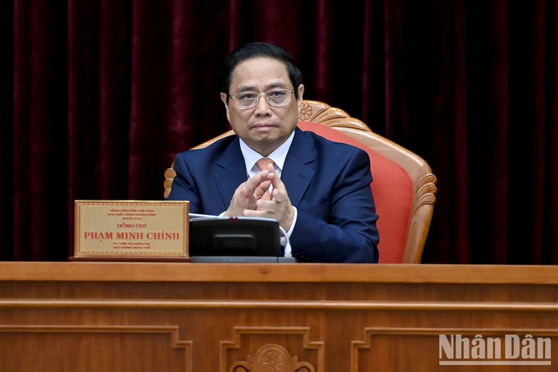 Prime Minister Pham Minh Chinh attends the closing session of the ninth session of 13th Party Central Committee.