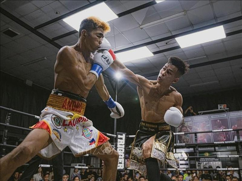 Boxer Tran Van Thao (R) competes with boxer Prince Andrew Lario from the Philippines. (Photo: VNA) Boxer Tran Van Thao (R) competes with boxer Prince Andrew Lario from the Philippines. (Photo: VNA)