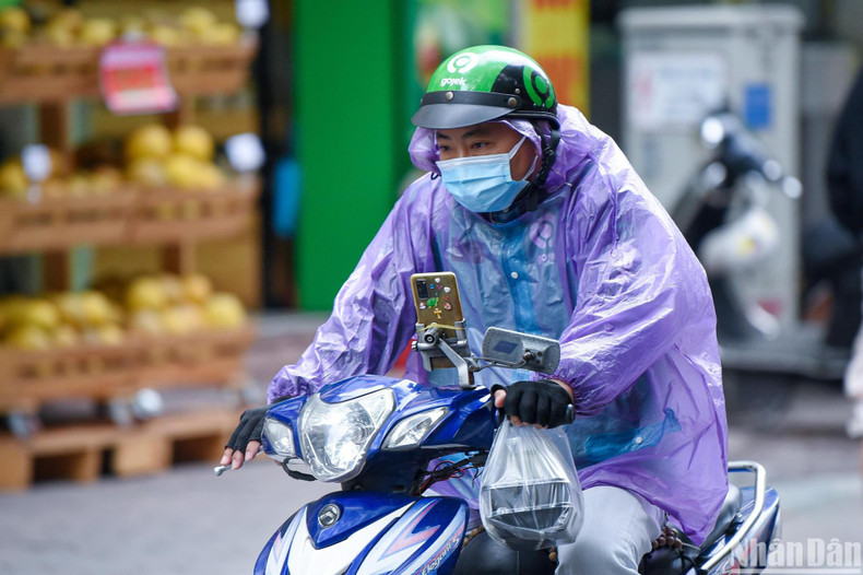 A man even wore raincoats to protect themselves from the cold weather. A man even wore raincoats to protect themselves from the cold weather.