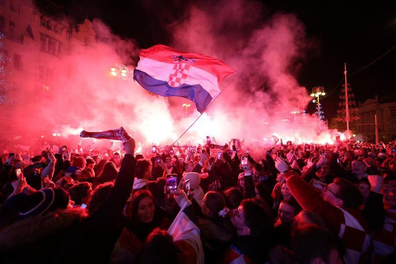Croatia fan with flares in Ban Josip Jelacic Square celebrate in Zagreb after the match as they finish in third place. (Photo: REUTERS) Croatia fan with flares in Ban Josip Jelacic Square celebrate in Zagreb after the match as they finish in third place. (Photo: REUTERS)