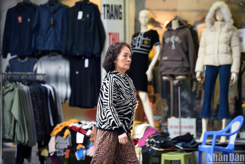 Shops display winter clothes on the main streets of Hanoi. Shops display winter clothes on the main streets of Hanoi.
