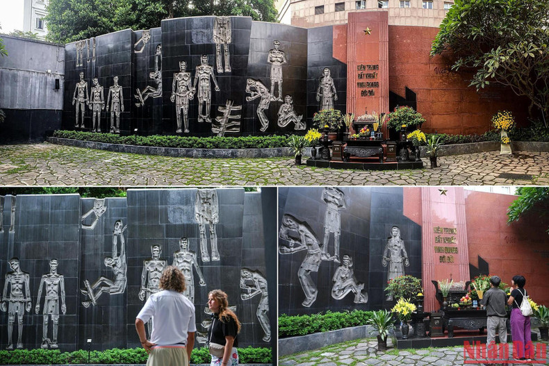 A memorial monument carving the image of the tortured prisoners was installed to commemorate the soldiers and revolutionaries who lost their lives at Hoa Lo Prison.