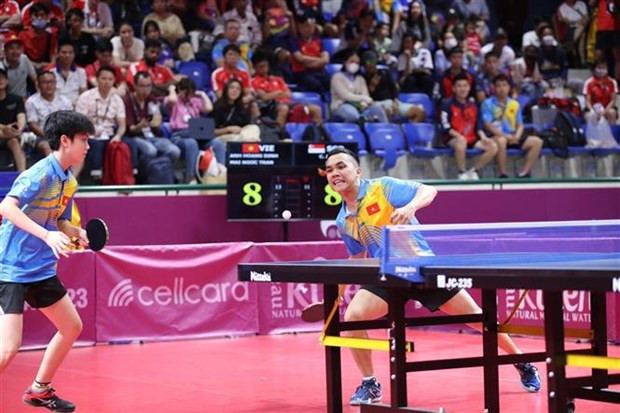 Table tennist players Dinh Anh Hoang (right) and Tran Mai Ngoc at the SEA Games 32. (Photo:VNA) Table tennist players Dinh Anh Hoang (right) and Tran Mai Ngoc at the SEA Games 32. (Photo:VNA)