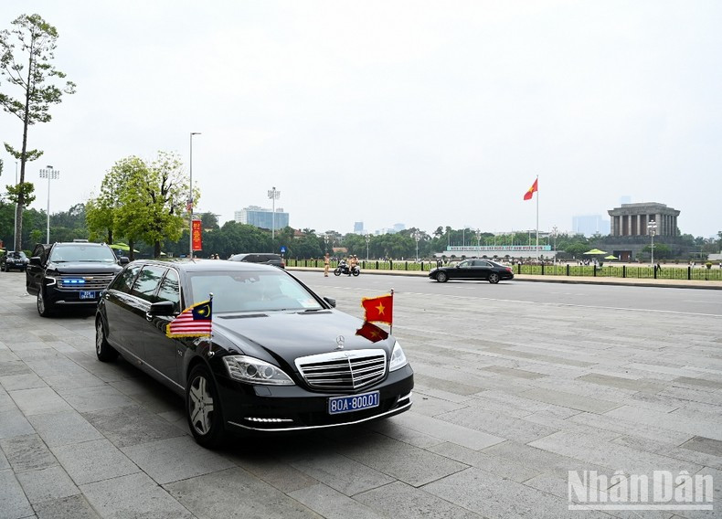 A convoy carries Malaysian Prime Minister Anwar Ibrahim to the NA Building
