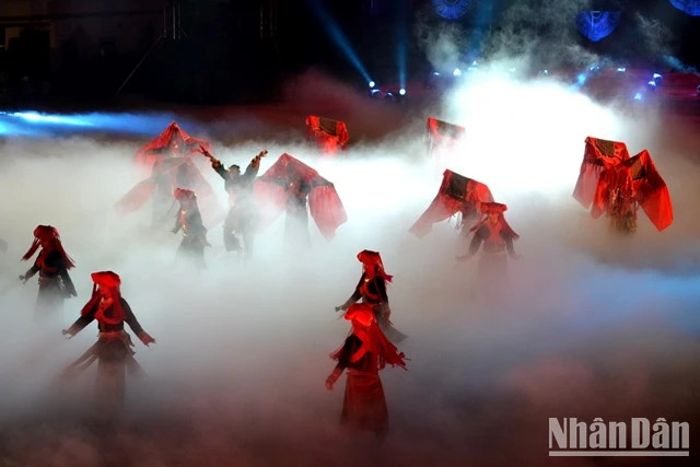 The red colour of the costumes of the Dao ethnic minority group is seen in a performance. (Photo: QUOC HONG)