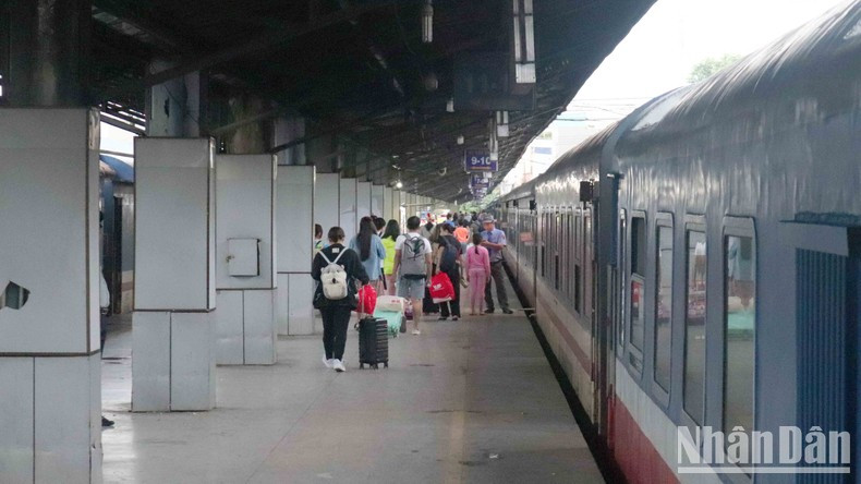 Station staff opened the door to check tickets and identification documents for passengers.