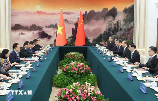 At the meeting between National Assembly (NA) Chairman Vuong Dinh Hue and Wang Huning, member of the Standing Committee of the Political Bureau of the Communist Party of China (CPC) Central Committee and Chairman of the Chinese People's Political Consultative Conference (CPPCC) National Committee. (Photo: VNA) At the meeting between National Assembly (NA) Chairman Vuong Dinh Hue and Wang Huning, member of the Standing Committee of the Political Bureau of the Communist Party of China (CPC) Central Committee and Chairman of the Chinese People's Political Consultative Conference (CPPCC) National Committee. (Photo: VNA)