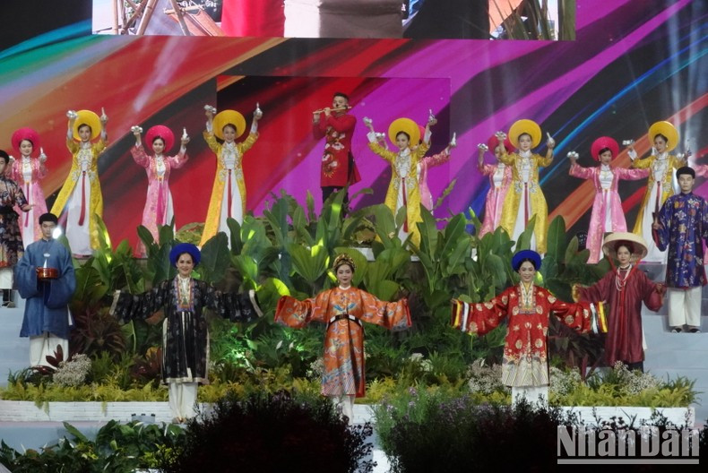 Models perform the Ao Dai collection "Natural Colour" by Designer Nguyen Duc Huy.