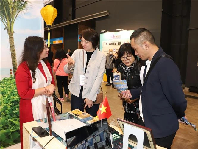 People visit Vietnam's tourism booth.