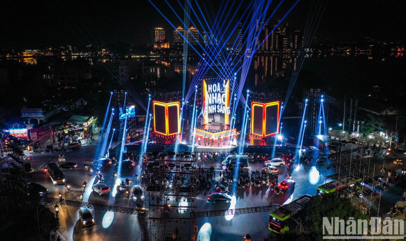 From above, the main stage of Light Symphony stands out amid the backdrop of West Lake, a cherished heritage of Hanoi. From above, the main stage of Light Symphony stands out amid the backdrop of West Lake, a cherished heritage of Hanoi.