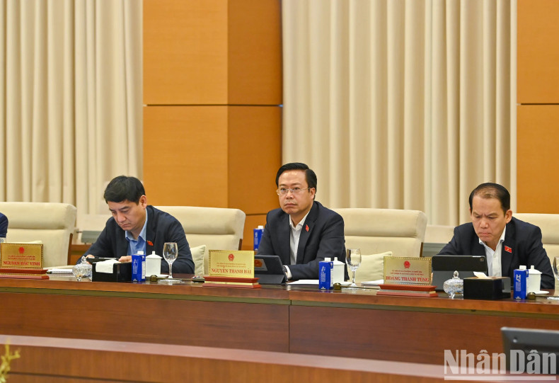 Delegates attend the session.