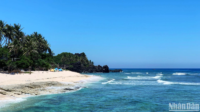 A beachfront area offering camping, dining, and nature-based experiences.