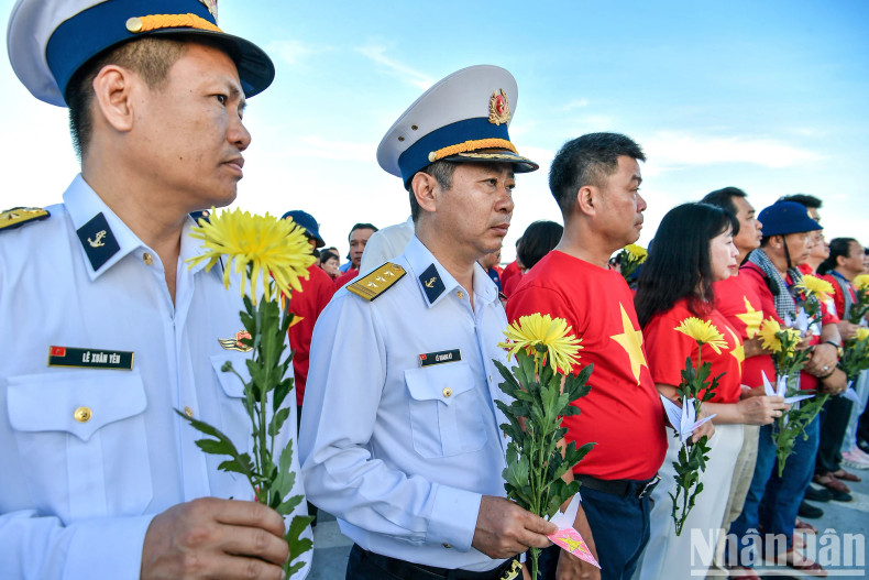 On the day of the memorial, hundreds of paper cranes and chrysanthemums were tenderly released into the sea by members of the delegation. On the day of the memorial, hundreds of paper cranes and chrysanthemums were tenderly released into the sea by members of the delegation.