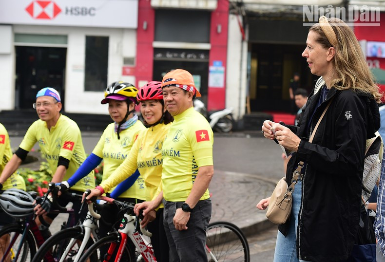The racers are enthusiastically cheered on by international tourists and bike lovers.