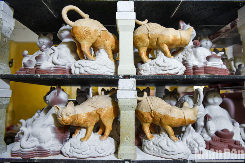 The ceramic pieces are coated with enamel before being fired in a kiln at 1,200C.