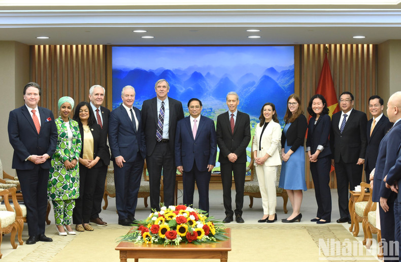 Delegates pose for a group photo at the event. Delegates pose for a group photo at the event.