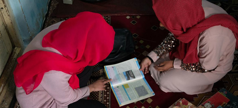 An Afghan girl studies at home with the help of her father after being denied the right to carry on studying at school. (Photo: UNICEF) An Afghan girl studies at home with the help of her father after being denied the right to carry on studying at school. (Photo: UNICEF)